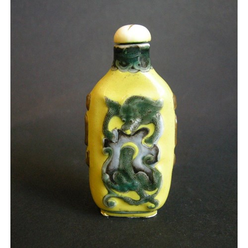 Porcelain snuff bottle influenced by Overlay glass bottle decorated with dragons on yellow ground - Guanxu period